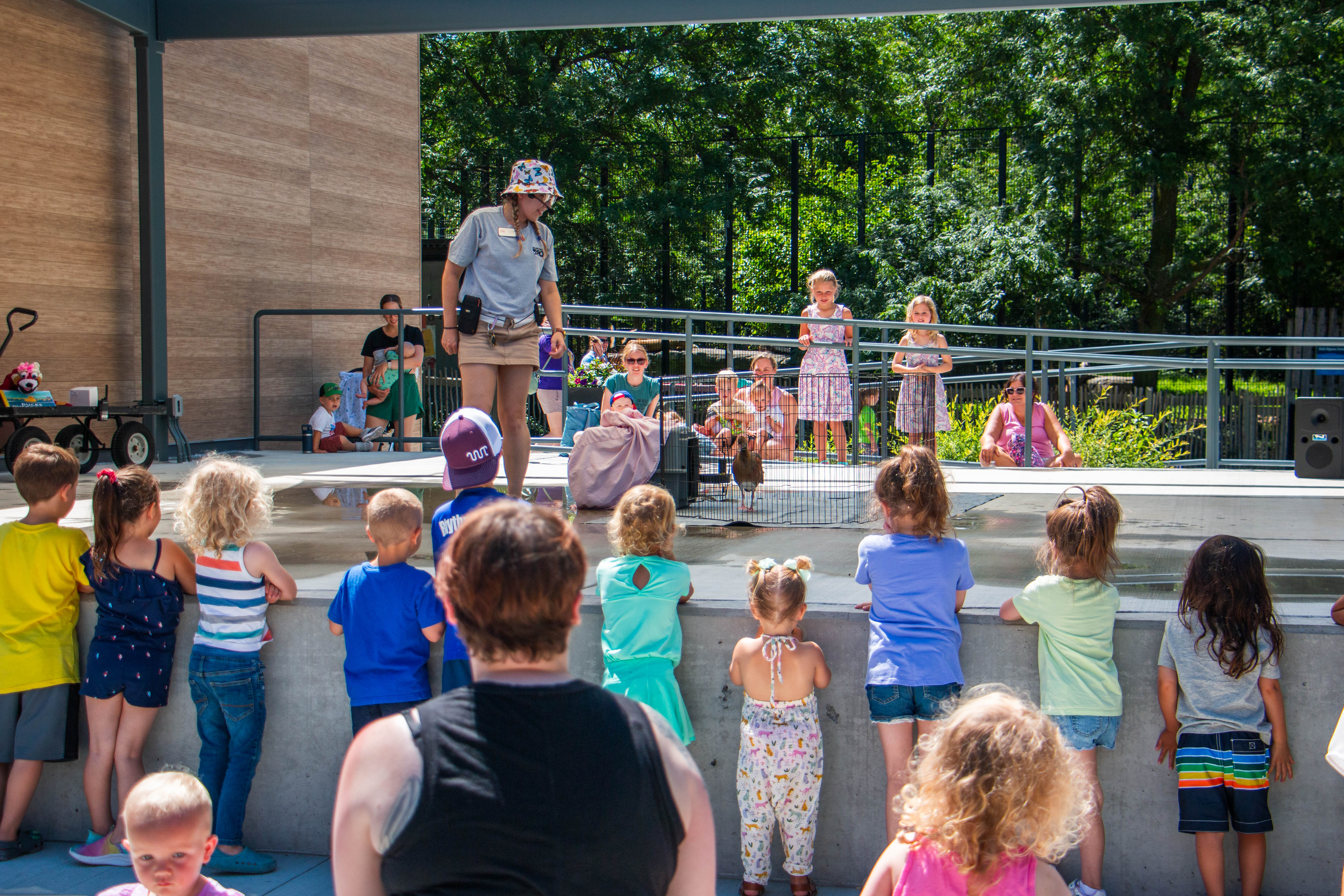 Educator with ambassador animal on joseph stage