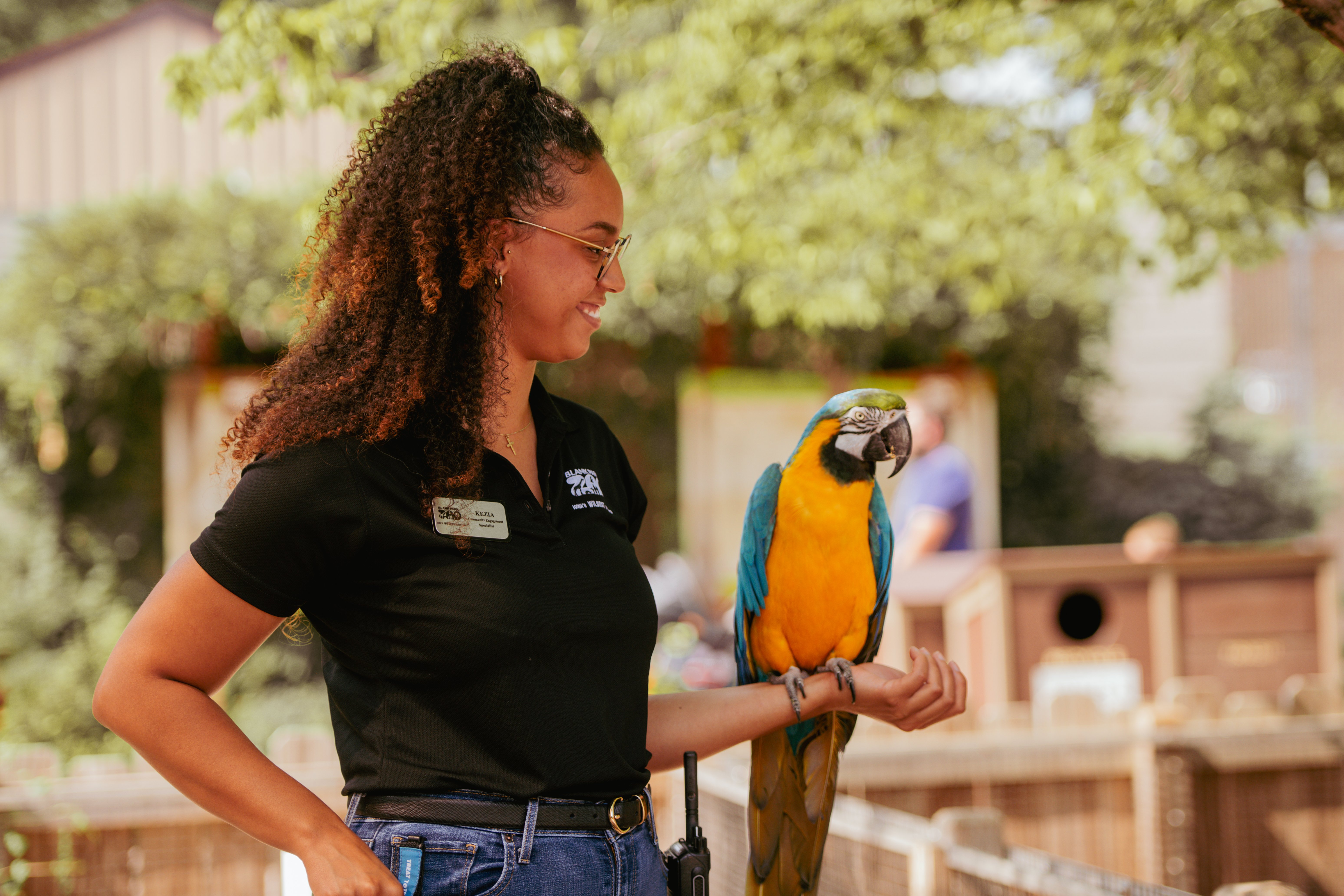 Educator holding macaw